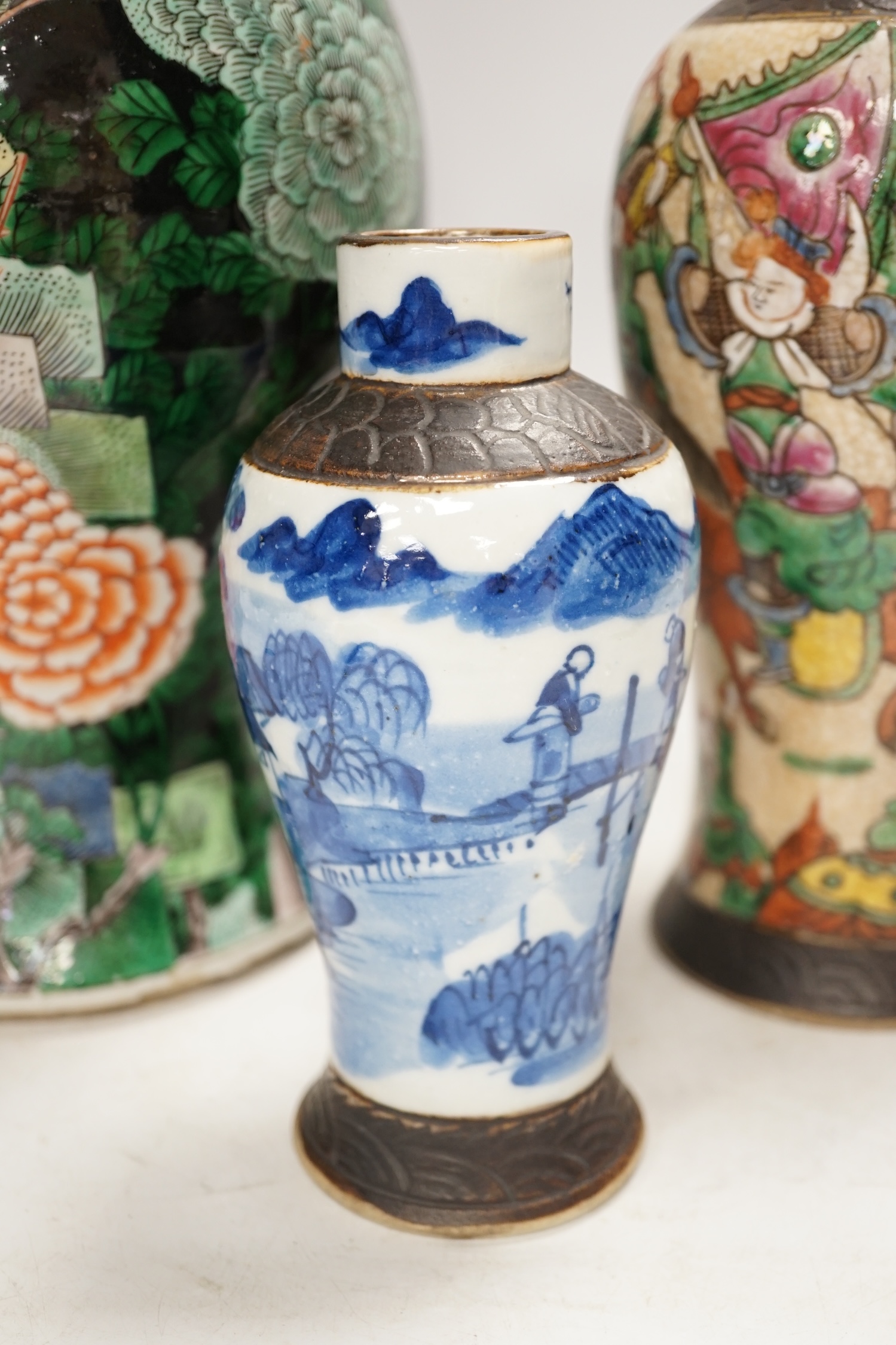 Three Chinese vases, 19th/early 20th century, including a cut down famille noire vase, crackleglaze and blue and white vases, tallest 34cm. Condition - fair to poor